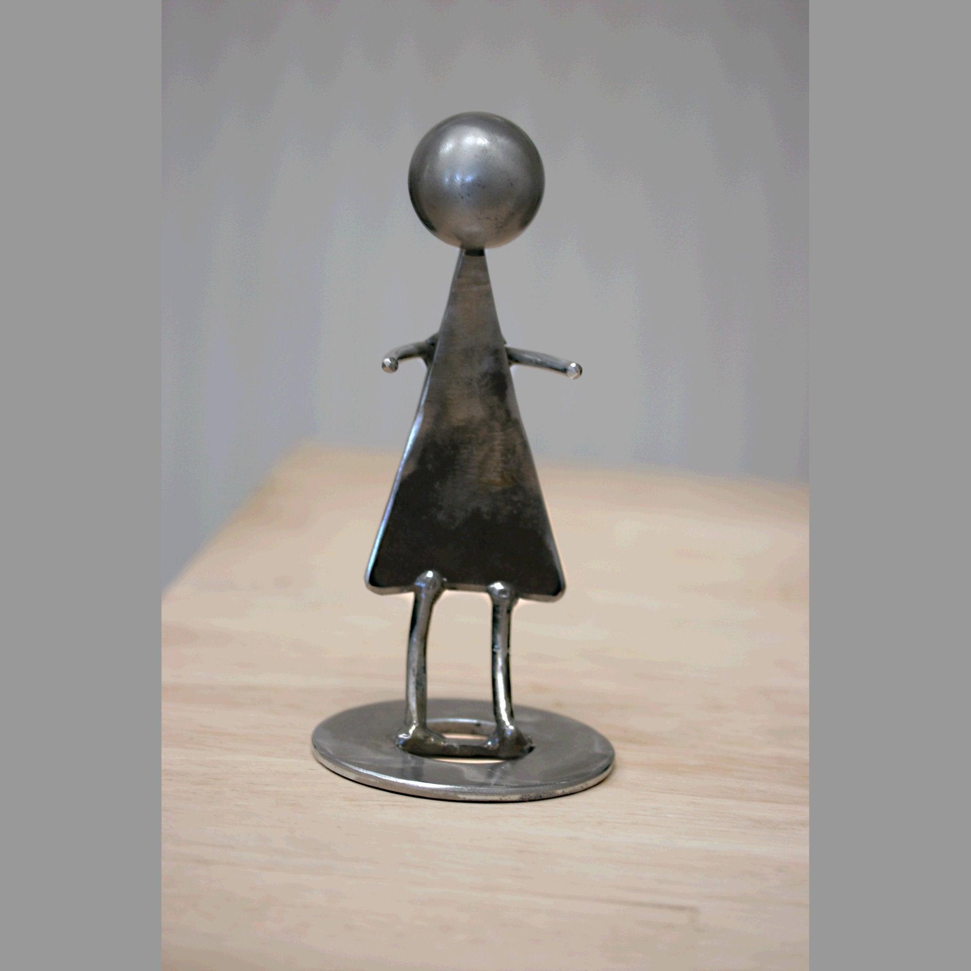 A delicate steel sculpture that captures the strength and grace of women.