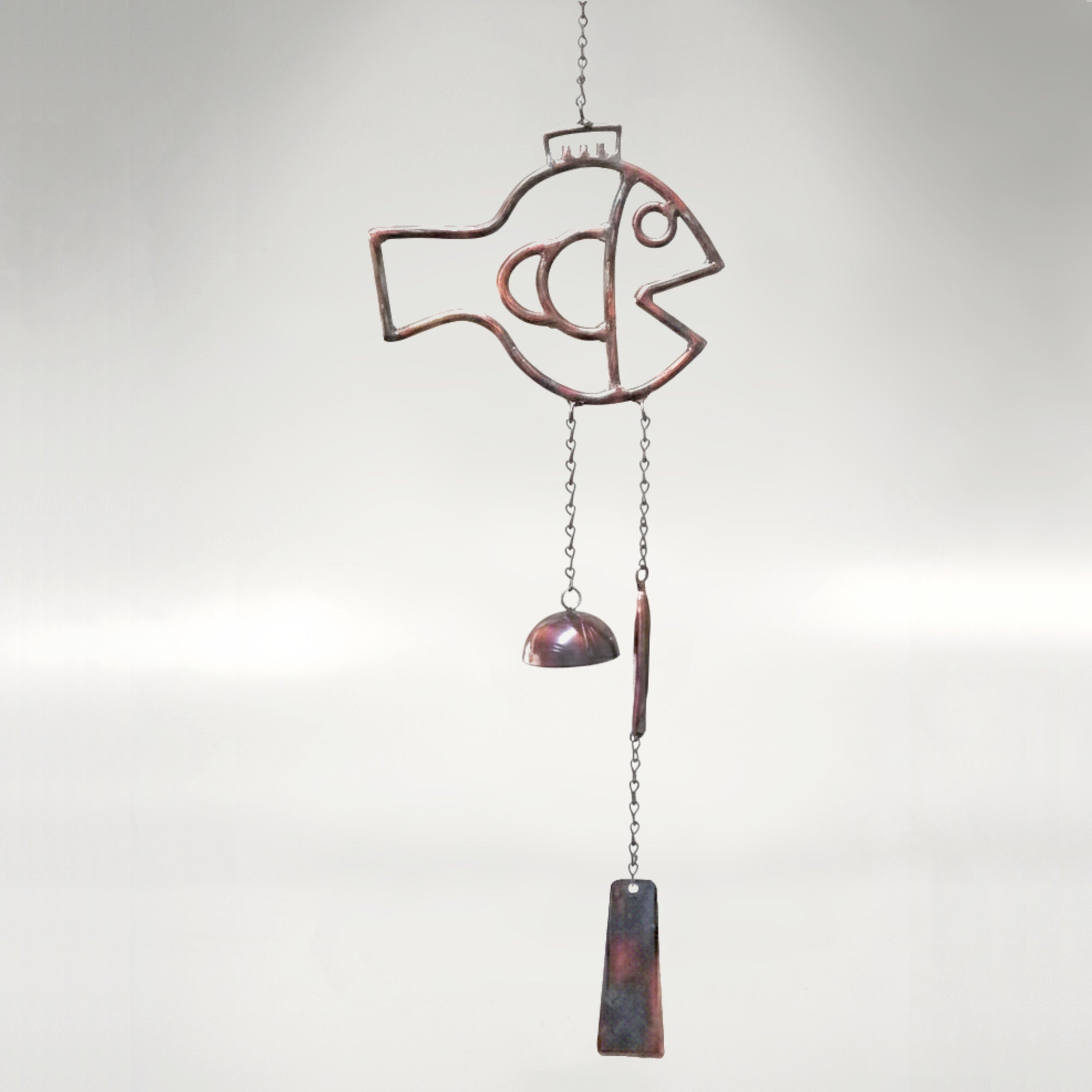 A fish themed windchime with a rustic torched copper finish.