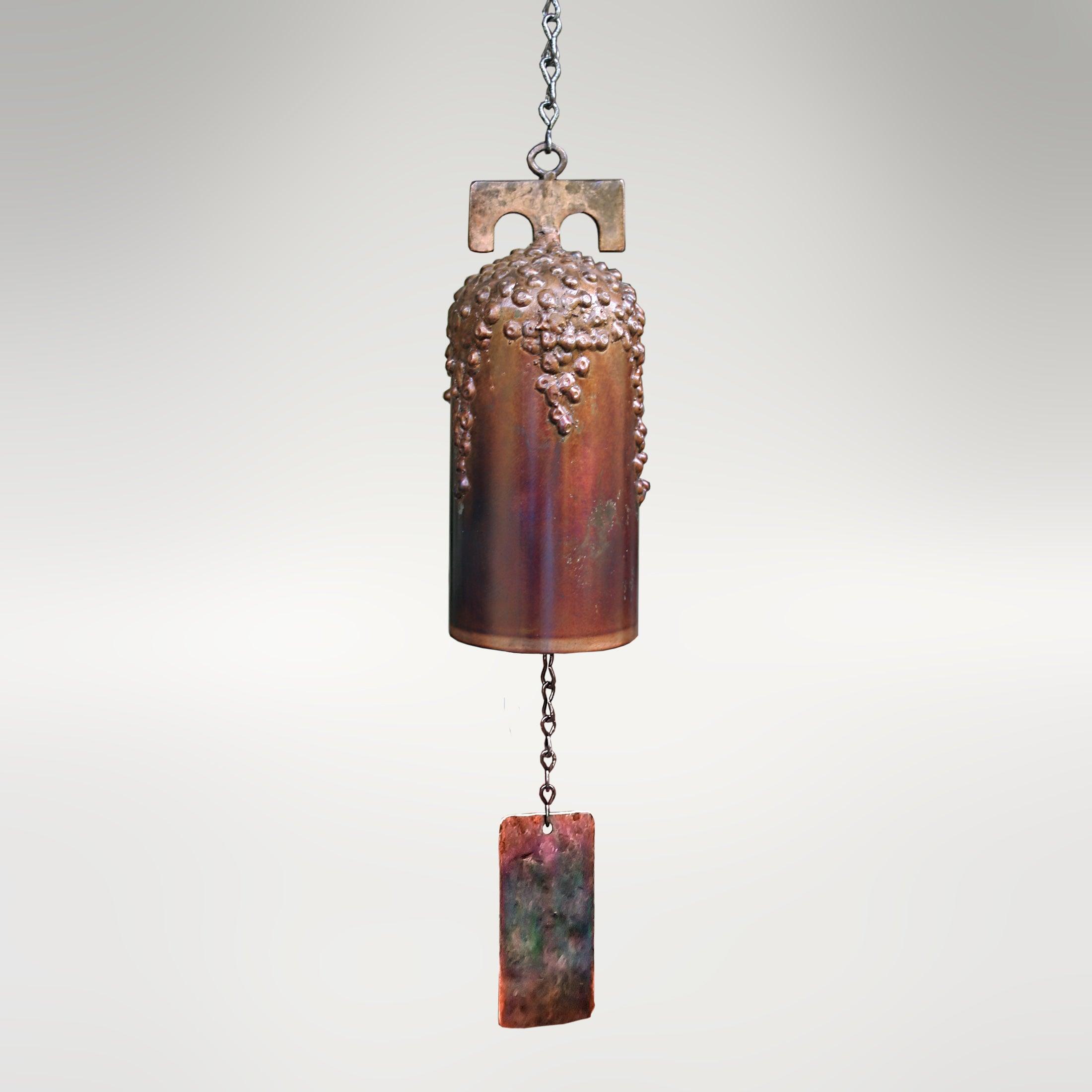 San Gabriel mission-style wind bell. The bell features our signature grape motif with intricate details on the bell’s surface that find their inspiration from grapes on the vine.