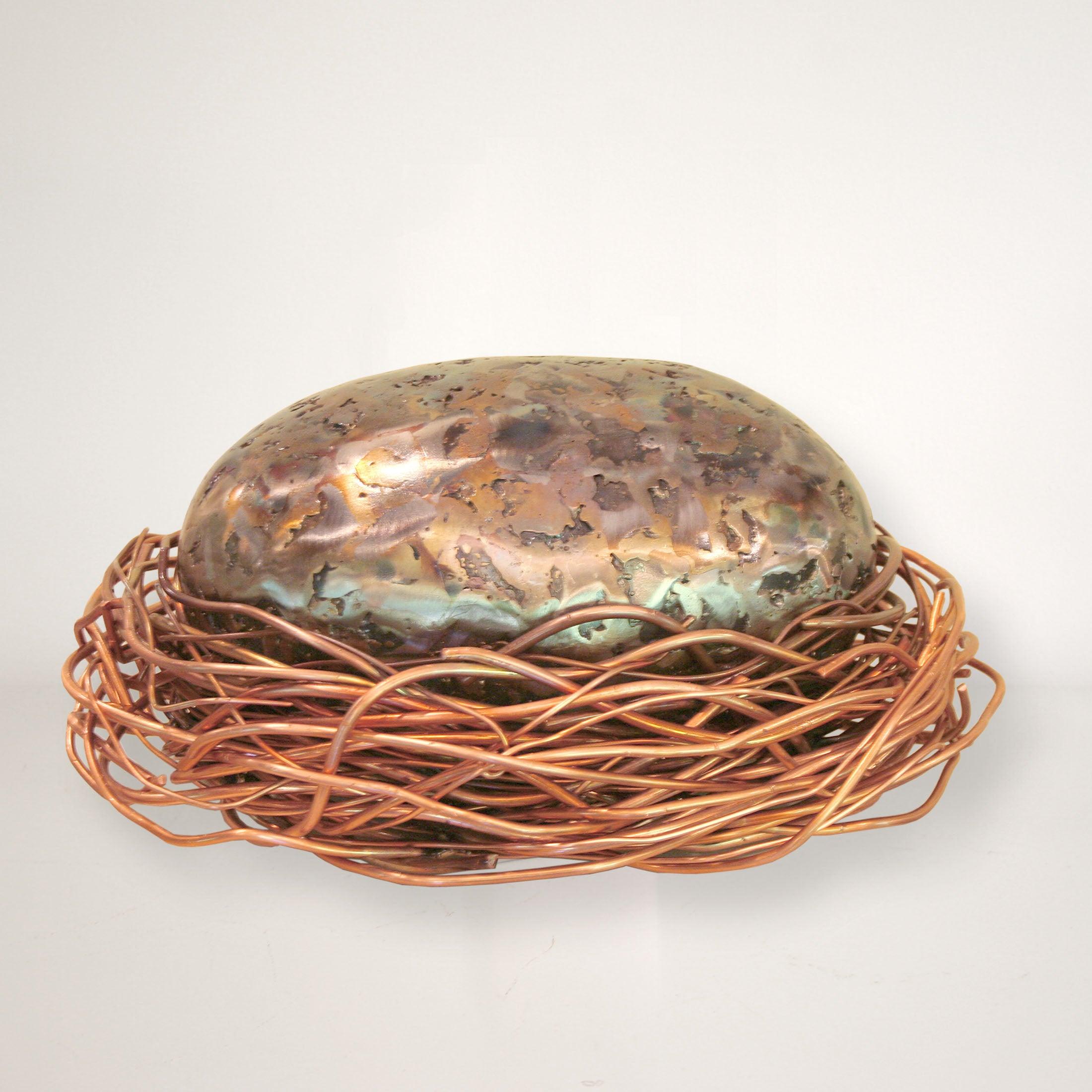 The Egg sculpture composed of torched steel and copper.