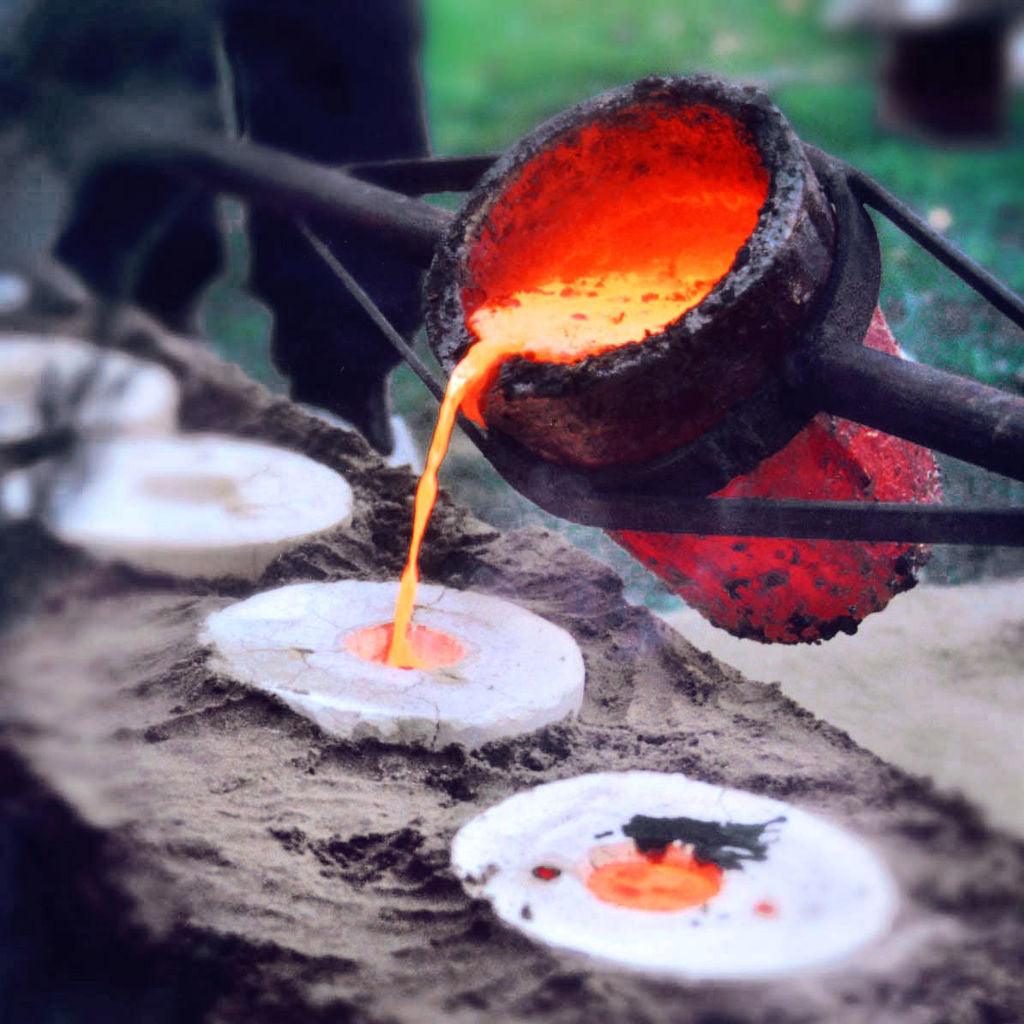 Molten metal poured into a mould. 