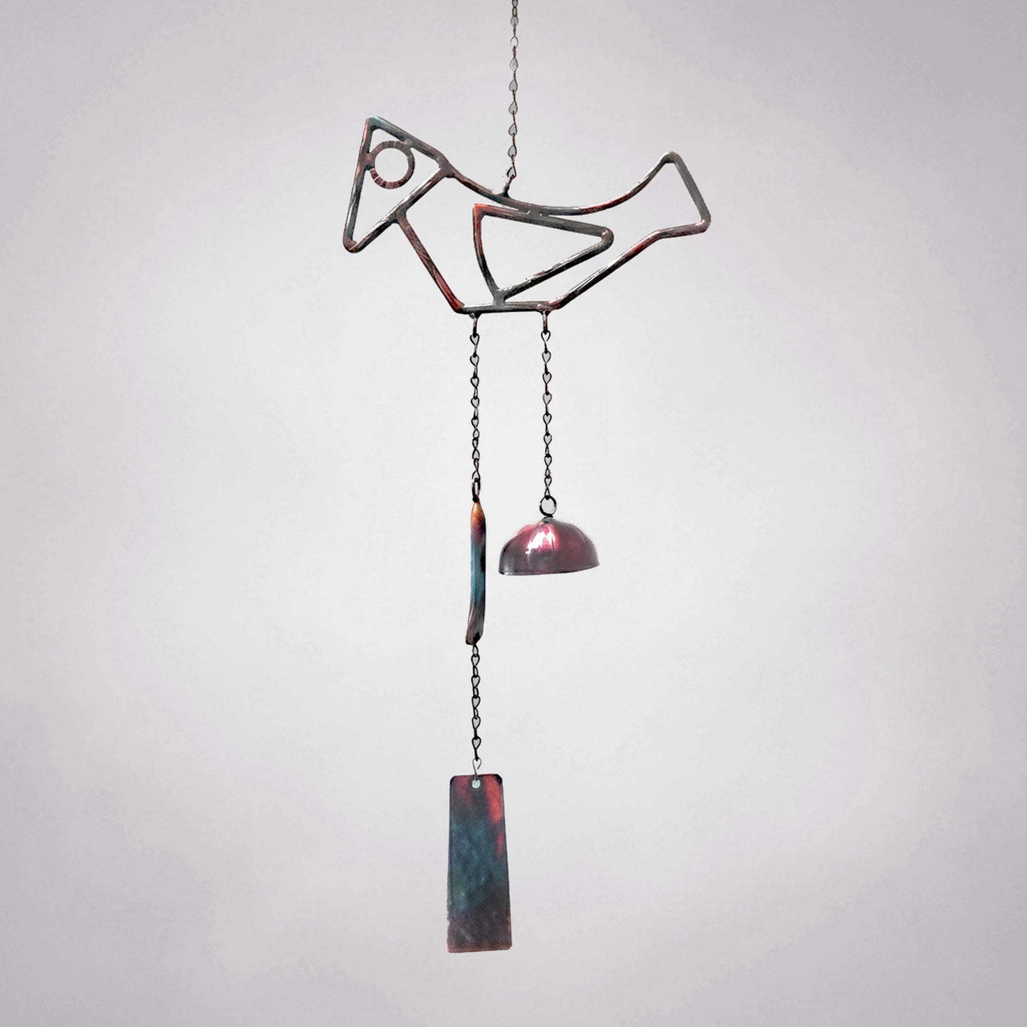 Decorative metal wind chime named Birdsong with hanging elements on a plain background
