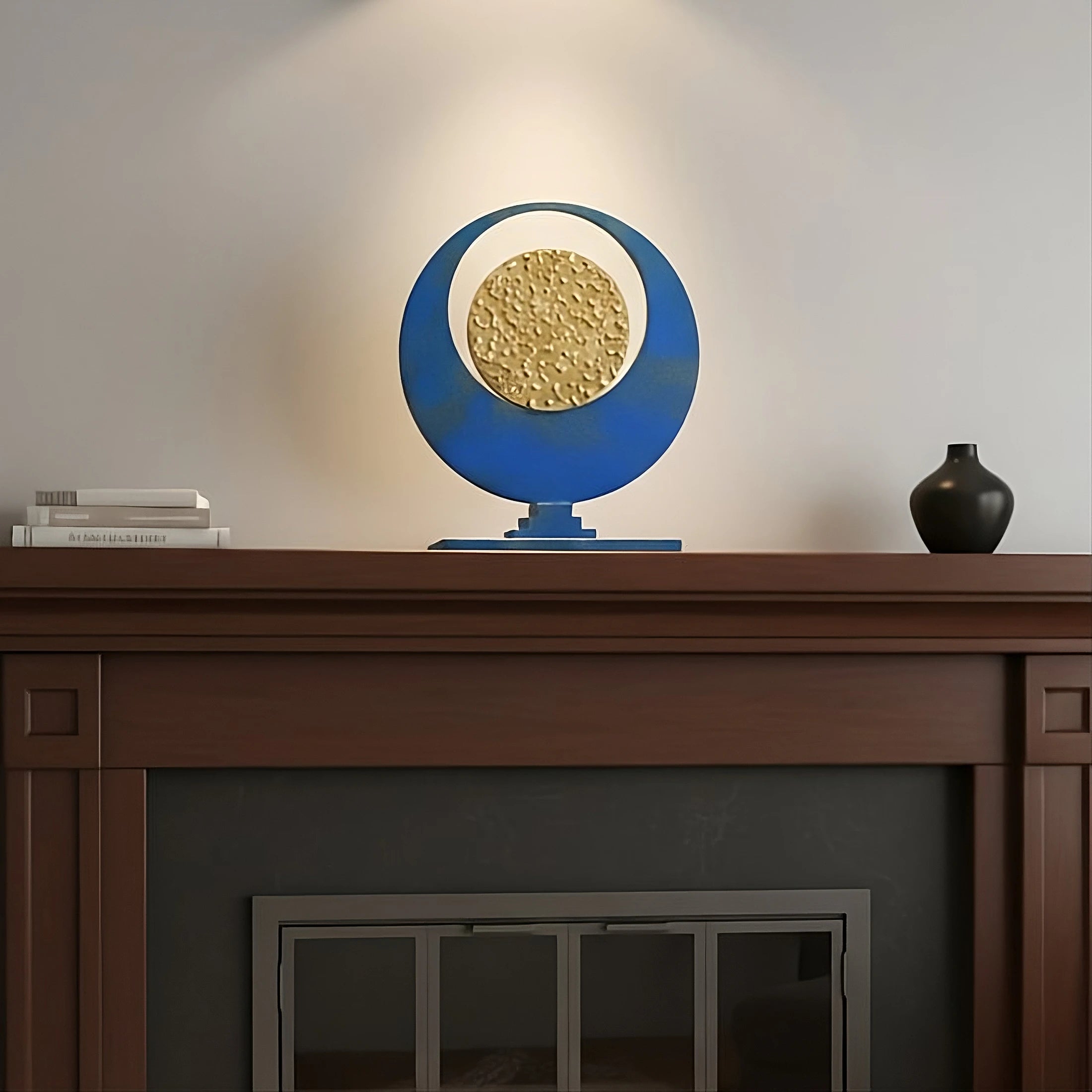 Converge. A mixed media tabletop sculpture composed of steel, bronze, and powder blue patina. 