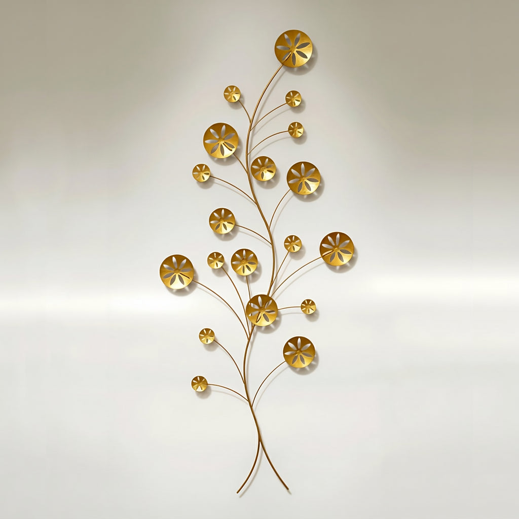 Gold-finished metal wall sculpture depicting an abstract, branching vine structure with multiple circular, stylized sand dollar shapes of varying sizes. The piece is mounted vertically against a pale background.
