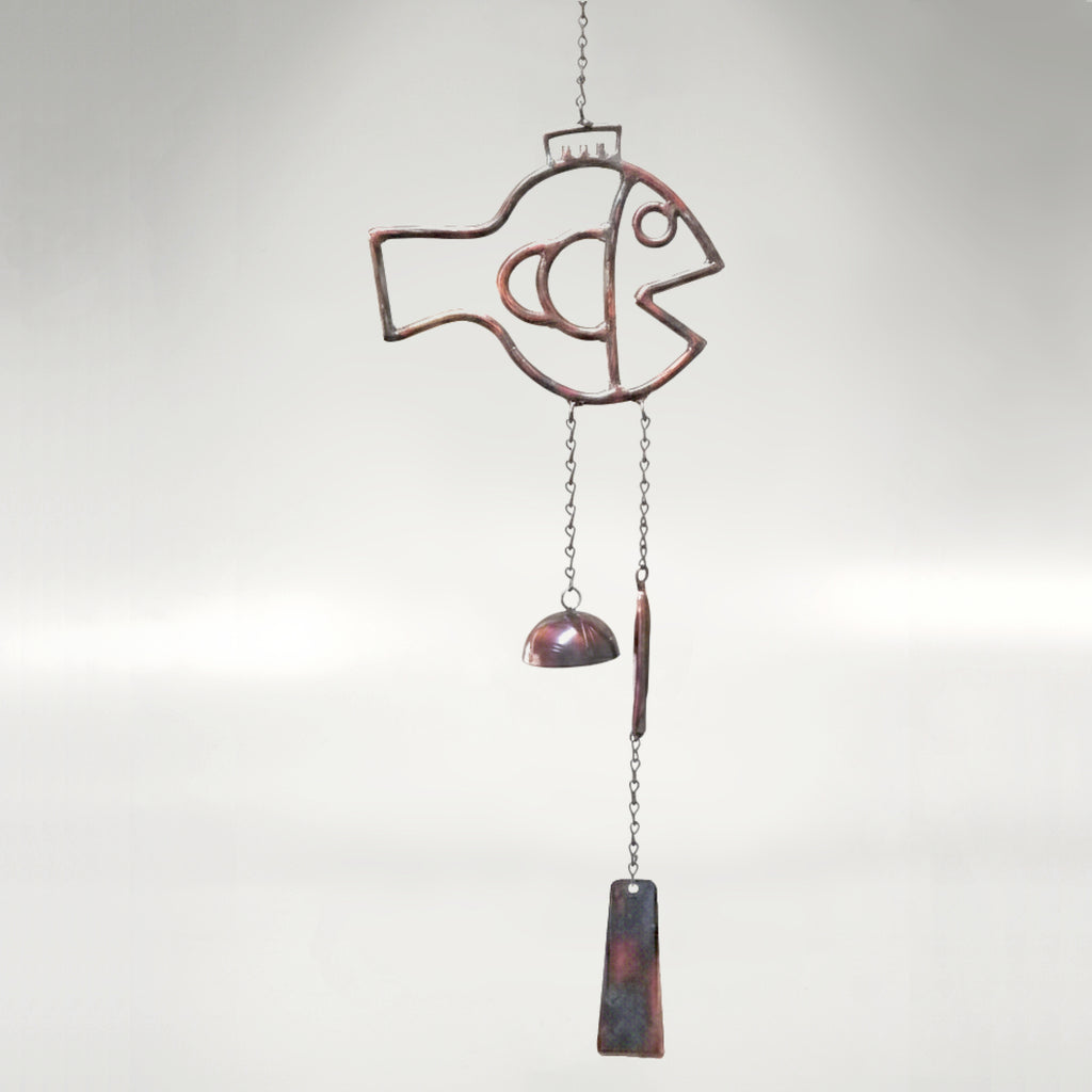 A fish themed windchime with a rustic torched copper finish. 